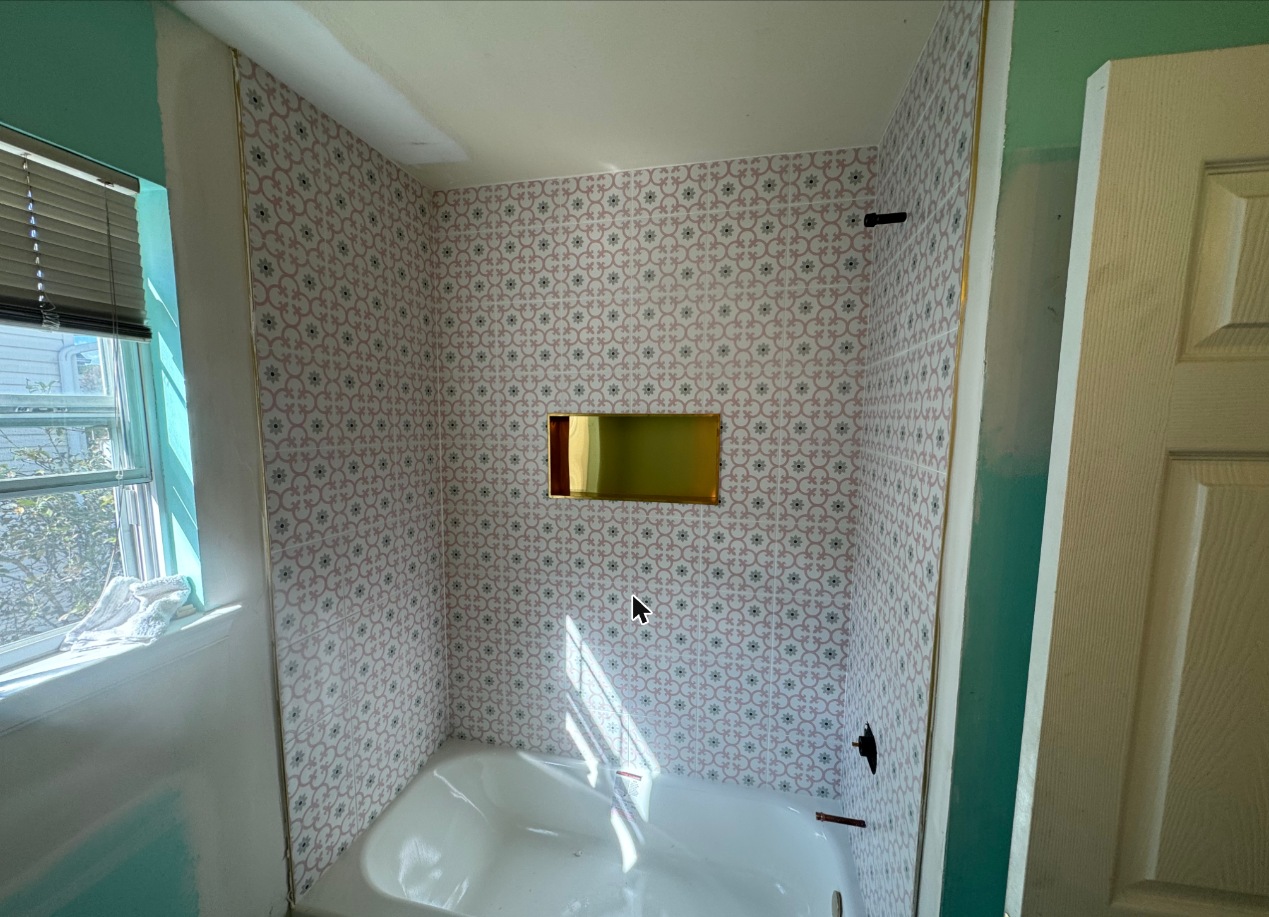 Bathtub surround with patterned tile and niche in Grasonville, MD — Assured Contracting Company