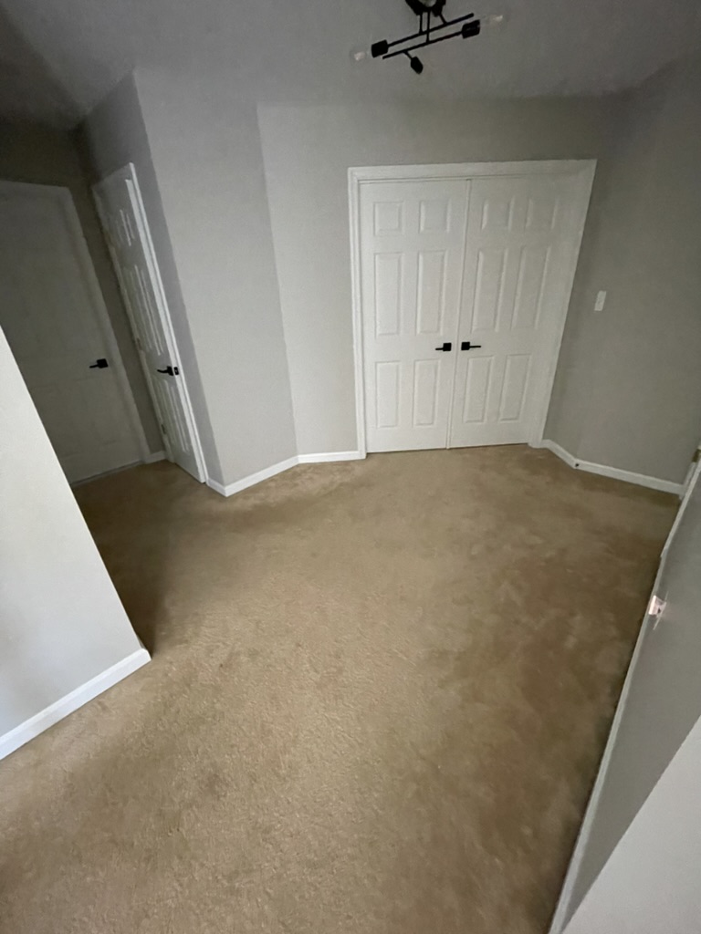 Finished basement room with new carpet and double closet in Grasonville, MD — Assured Contracting Company