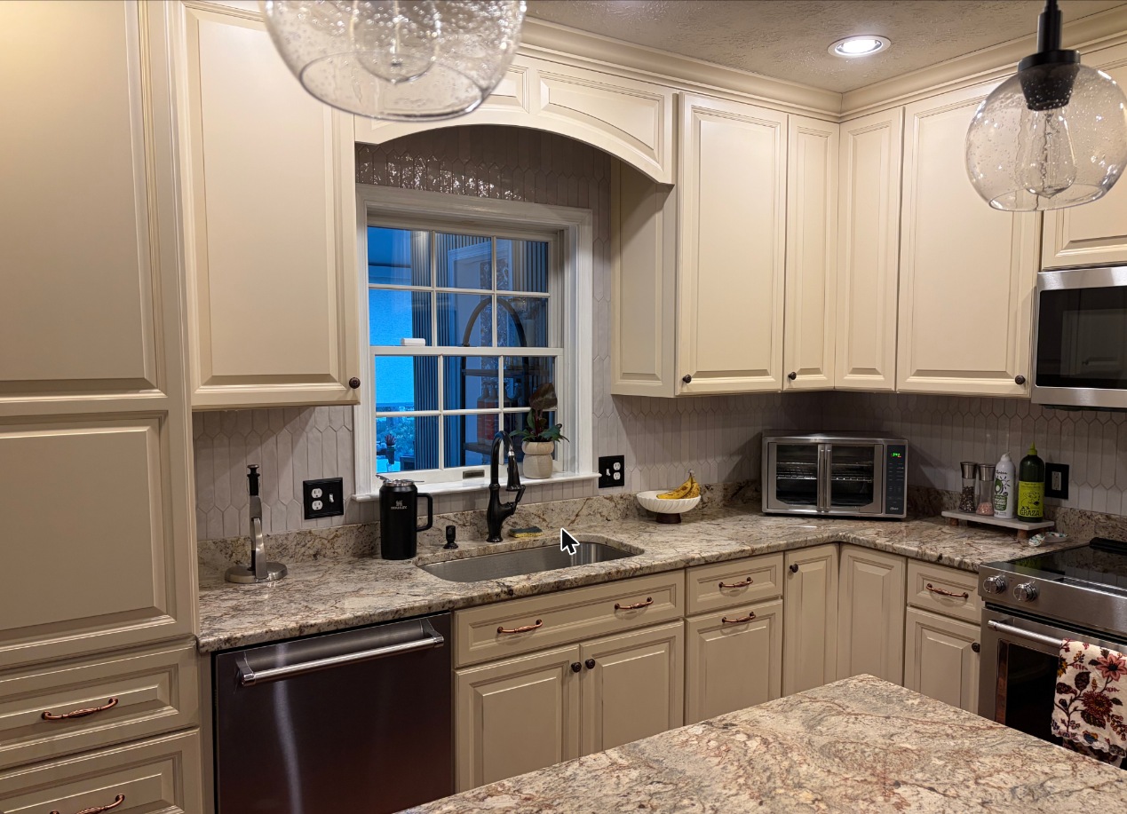 Kitchen remodel with cream cabinets, granite and arched window in Grasonville, MD — Assured Contracting Company