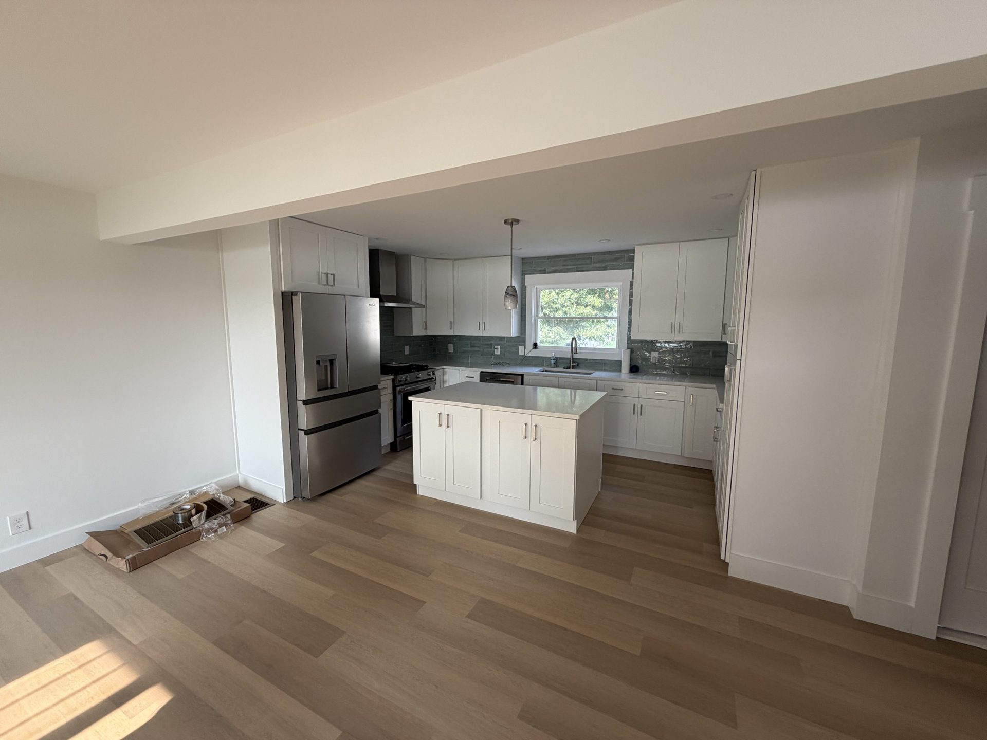 Home addition with open kitchen and living area in Grasonville, MD — Assured Contracting Company